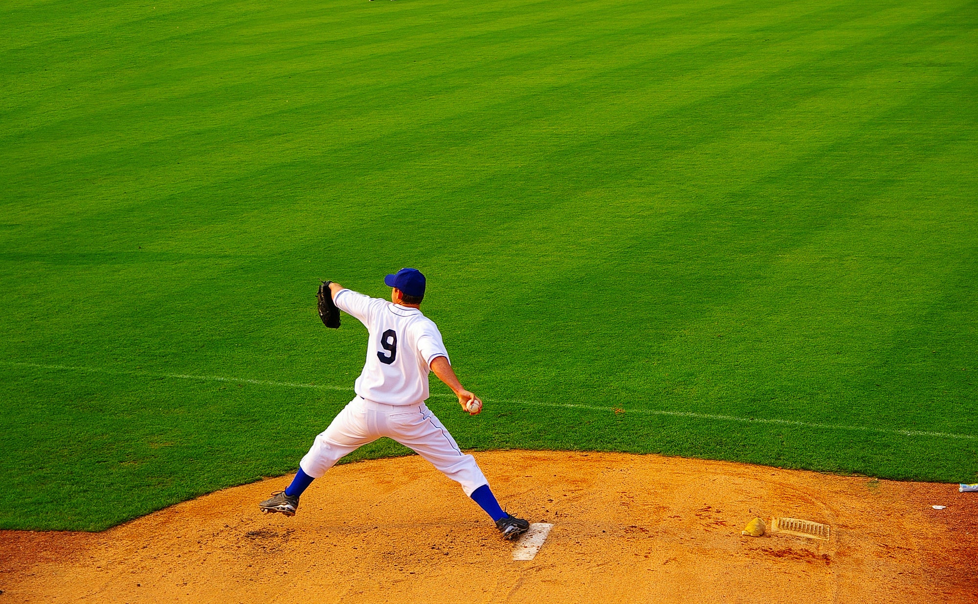 Can you throw a ball with a batting glove farther than with a naked hand?